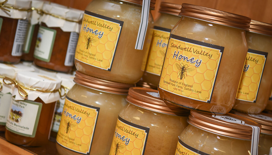 Image shows bottles of sandwell valley honey and other valley produces