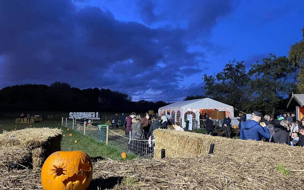 Entrance to pumpkin picking venue at forge mill farm during late in the evening